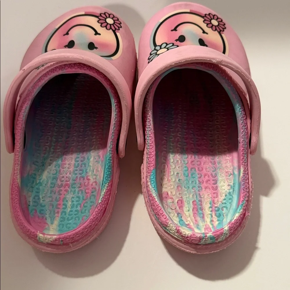 Pink clog slides‎ in a girls size 12, with pastel swirl in sole and nonslip.